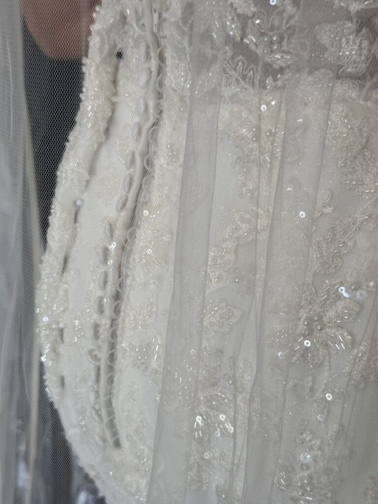 Hackbridge bridal alterations first fitting close up of pinning