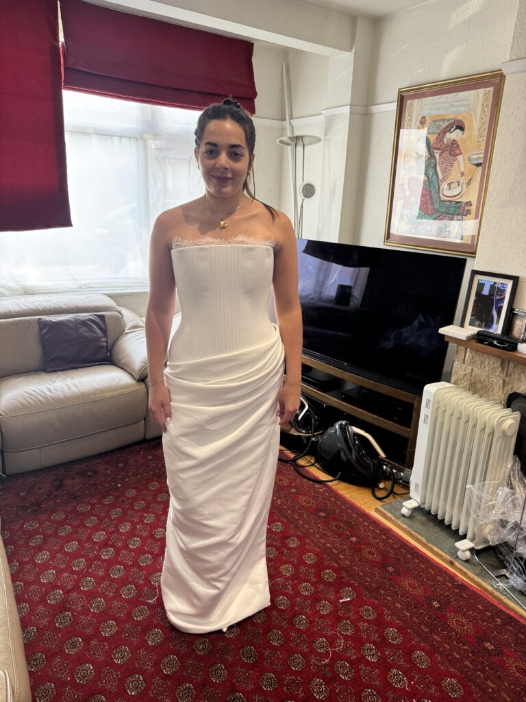 Walton-on-the-Hill bride wearing her altered KYHA Eaton wedding dress front view fitting.