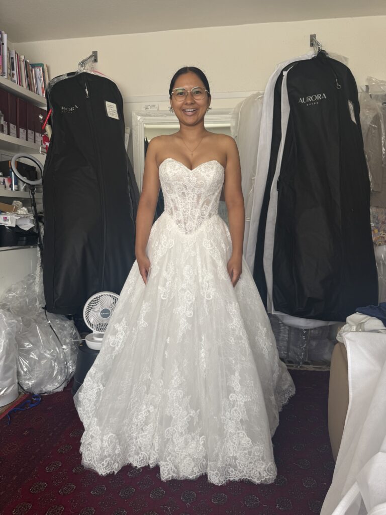 Intricate lace border carefully separated before shortening the Anna Sorrano Mercia wedding dress final fitting