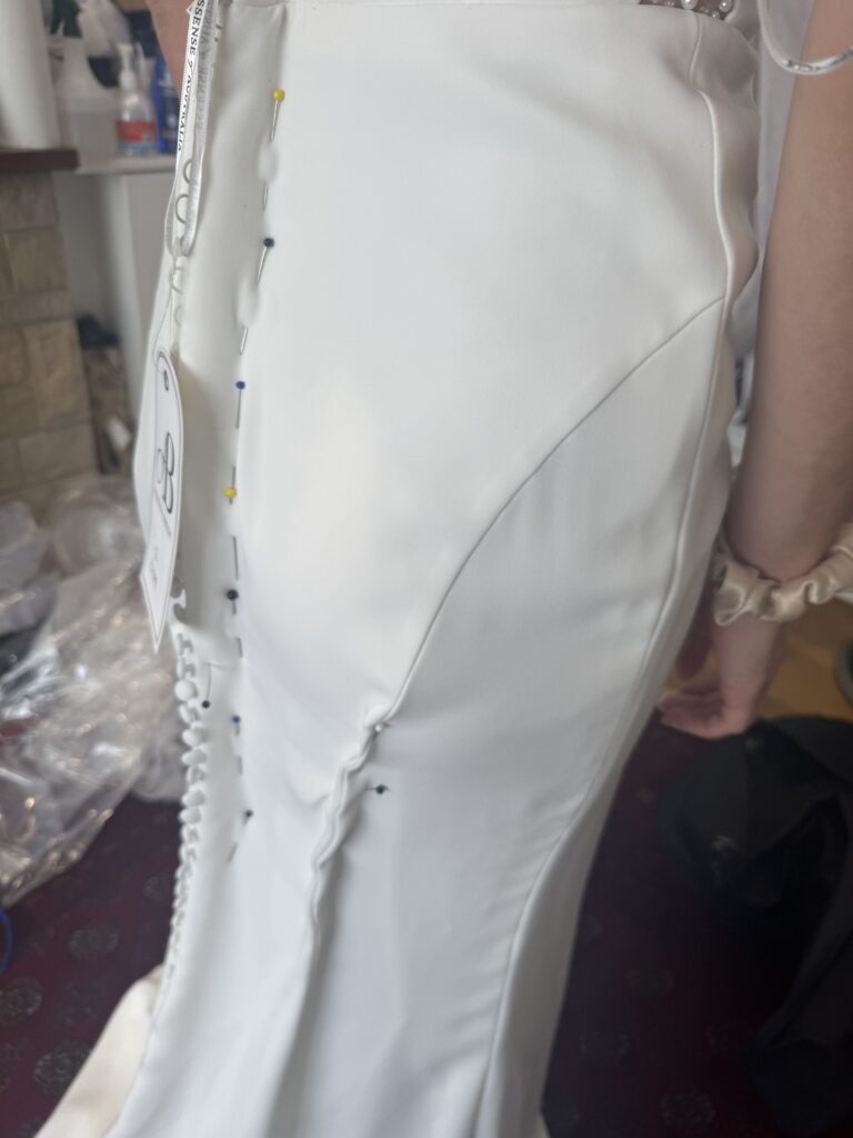 Raynes Park Wedding Dress Alterations showing close up of pinned amount for a perfect fitting on my bride.