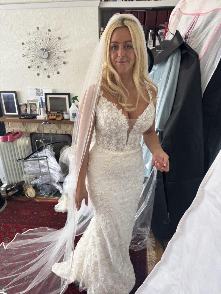 Hackbridge bride wearing Danielle Couture wedding dress at bridal fitting pinning alterations for a perfect fit.