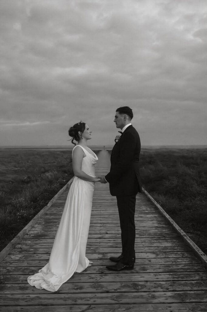 Black and white wedding dress photograph of the bride and groom on wedding day.