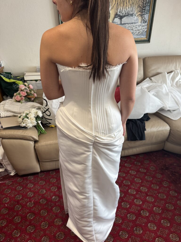 Walton-on-the-Hill bride wearing her altered KYHA Eaton wedding dress at final fitting back view.