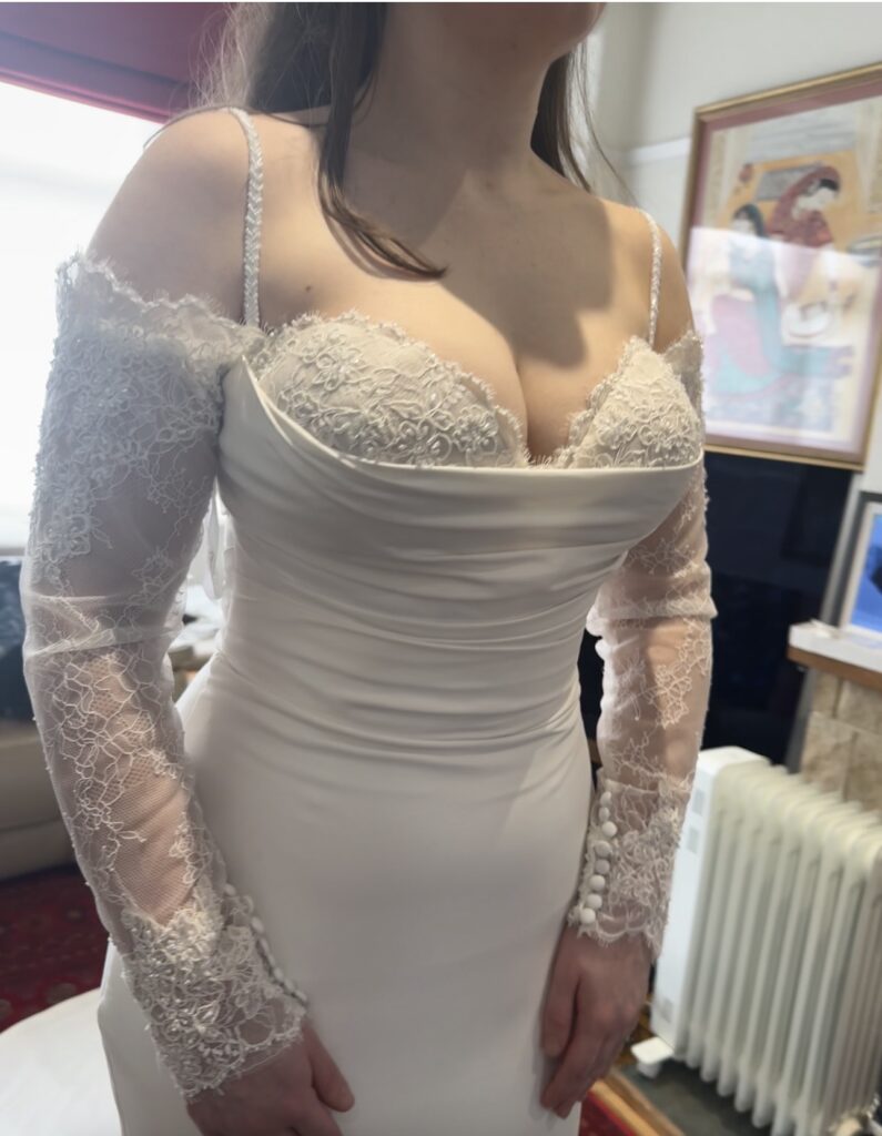 straps beaded by hand added to the wedding dress, contouring bust, sleeve reshaped and dress hemmed Allure Bridals Wedding Dress Alterations