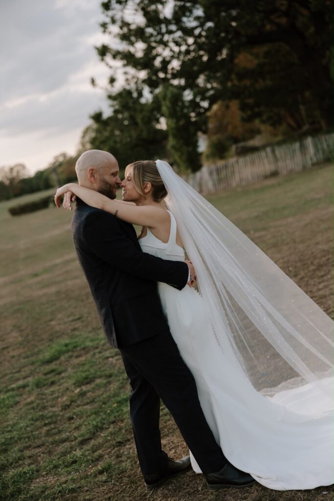 side view of bride’s well fitted and expertly altered allure wedding dress.