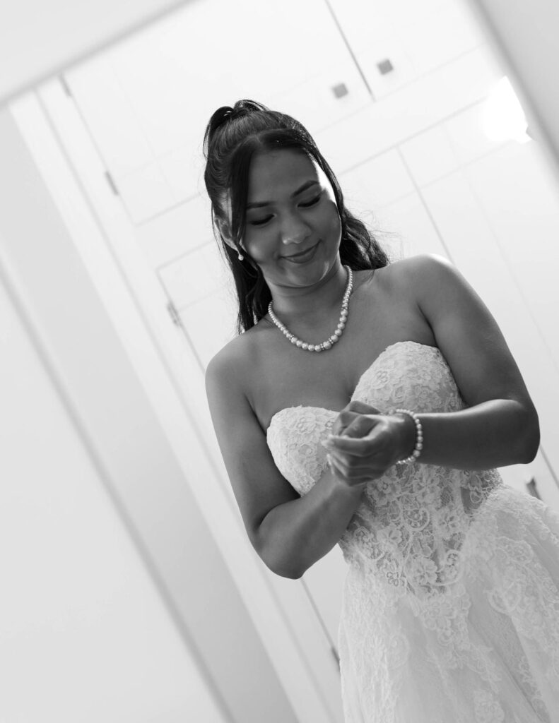 Close-up black-and-white portrait showing the sweetheart neckline and lace bodice of the bride’s Anna Sorrano Mercia gown