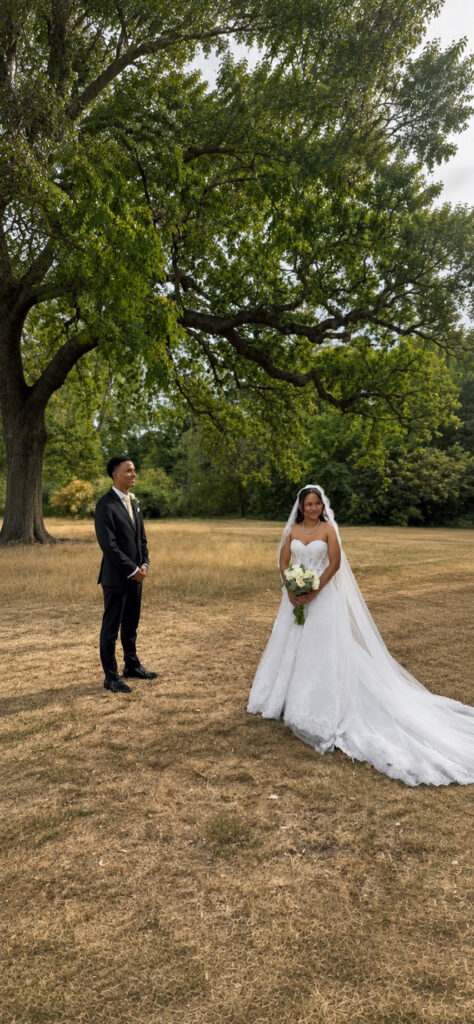 Greater London bride and groom photographed outdoors with the altered Anna Sorrano Mercia wedding dress