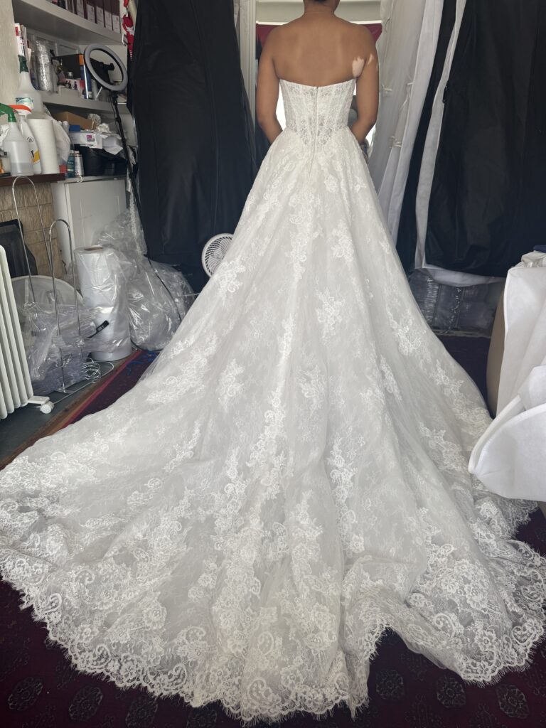 Sutton bride trying on her Anna Sorrano Mercia wedding dress at WED2B after alterations.