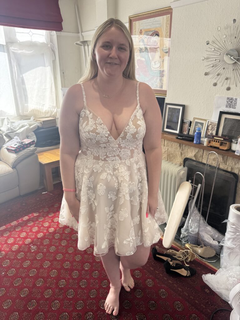 Dorking bride at her final fitting in a short Dama Couture Amanda lace wedding dress