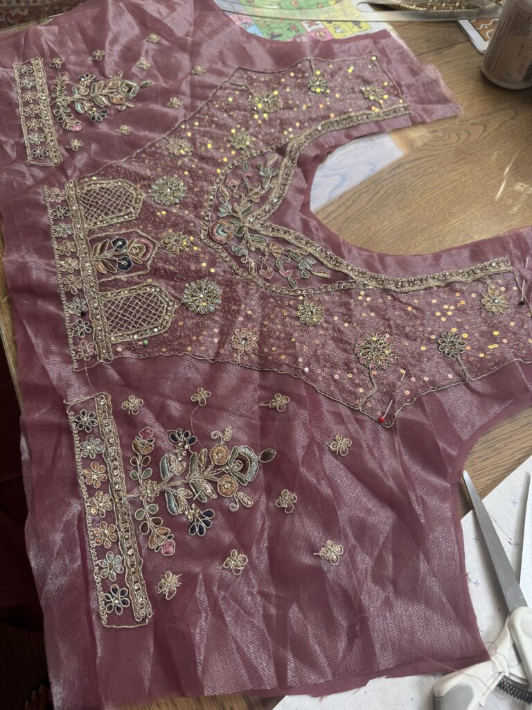 Hayes bride blouse stitching in progress of the dusty rose embroidered lehenga and supportive fitted choli.