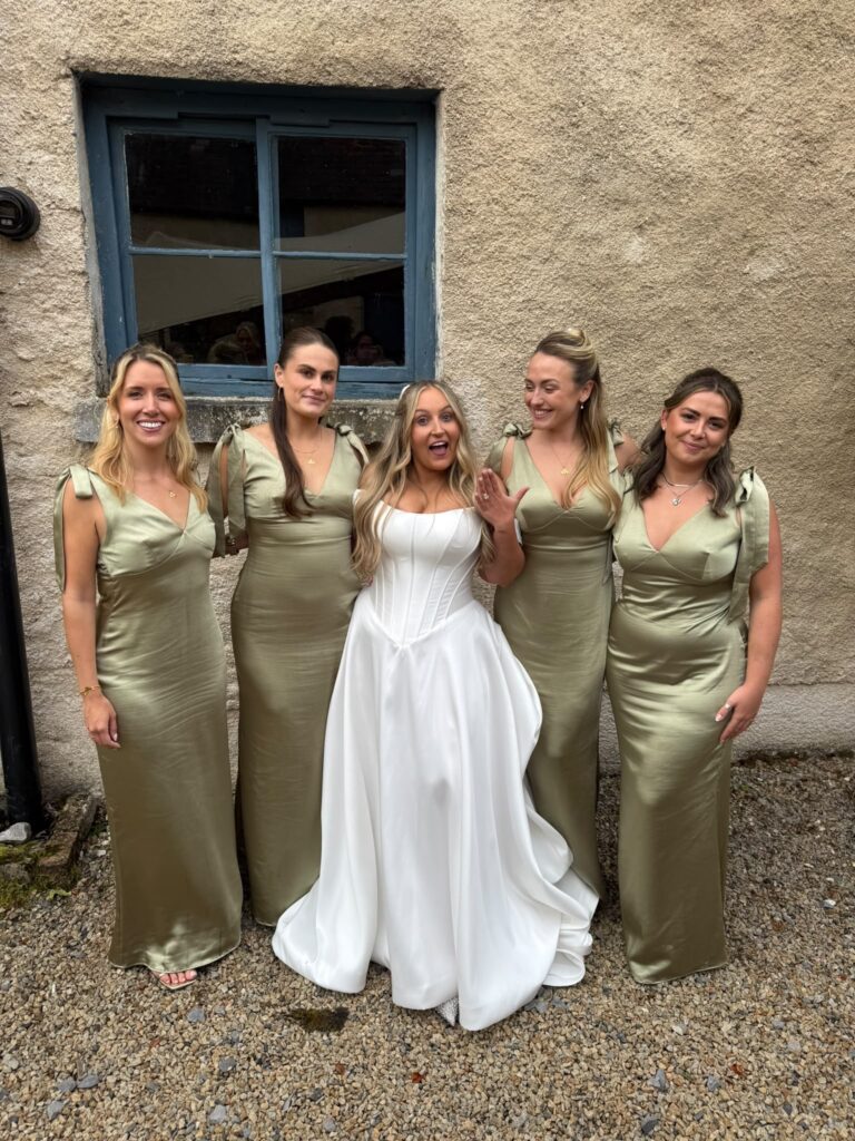 Isabella Grace Bridal Alterations with her bridesmaids on the wedding day.