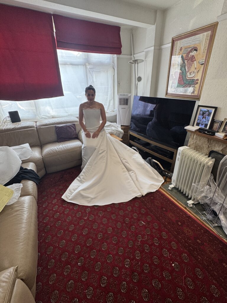 Walton-on-the-Hill bride wearing her altered KYHA Eaton wedding dress train spread out nicely.