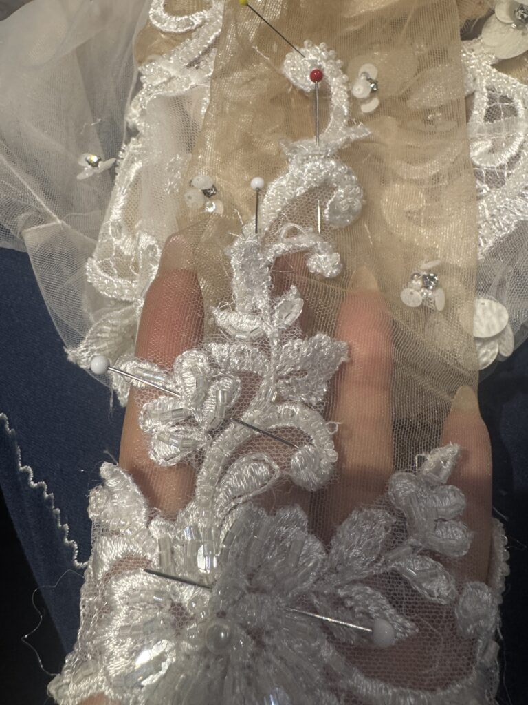 Sleeve fully adjusted on a layered Berta Muse Nila wedding dress