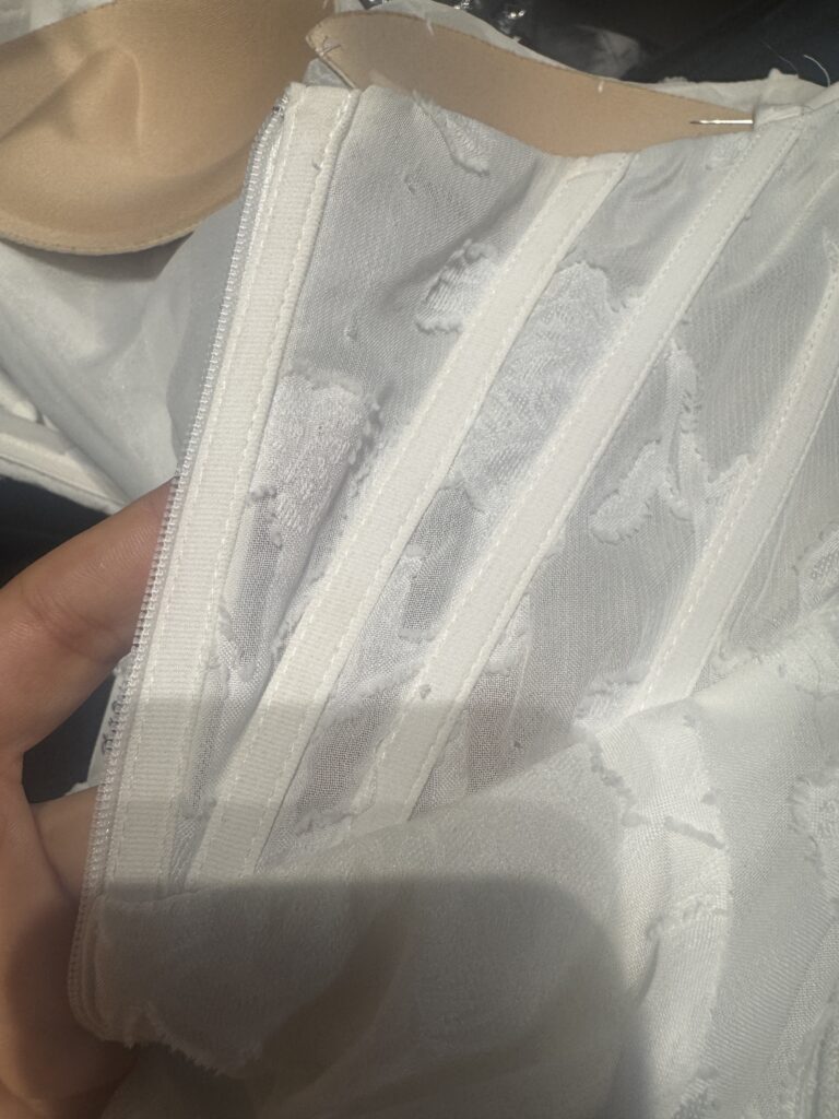 Boning and bust cups had all got to be redone after resizing on this Stella York Bridal Alterations for a Worcester Park bride detail view.
