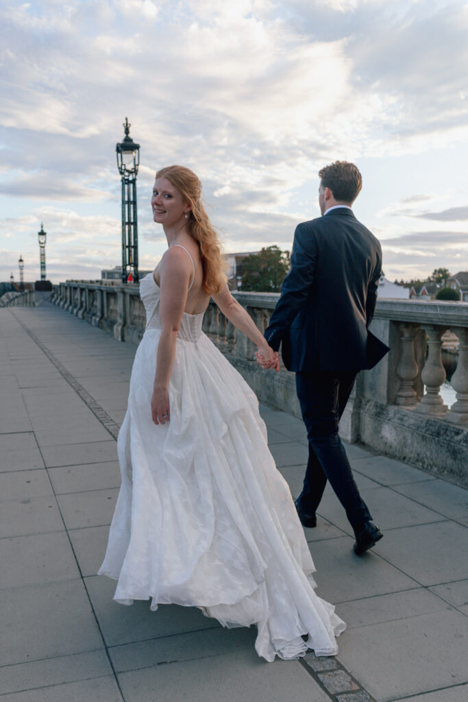 Bride as she wears her Stella York gown bustled up train.