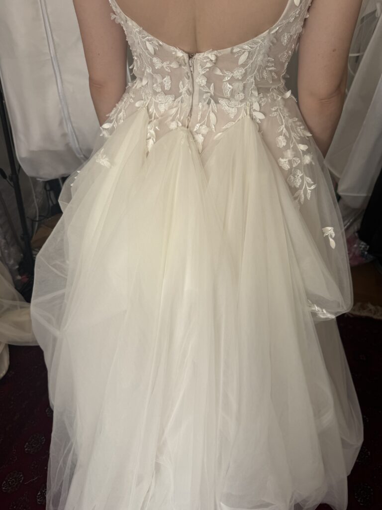Stella York Crawley Bridal Alterations showing three point American bustle to hook up train.