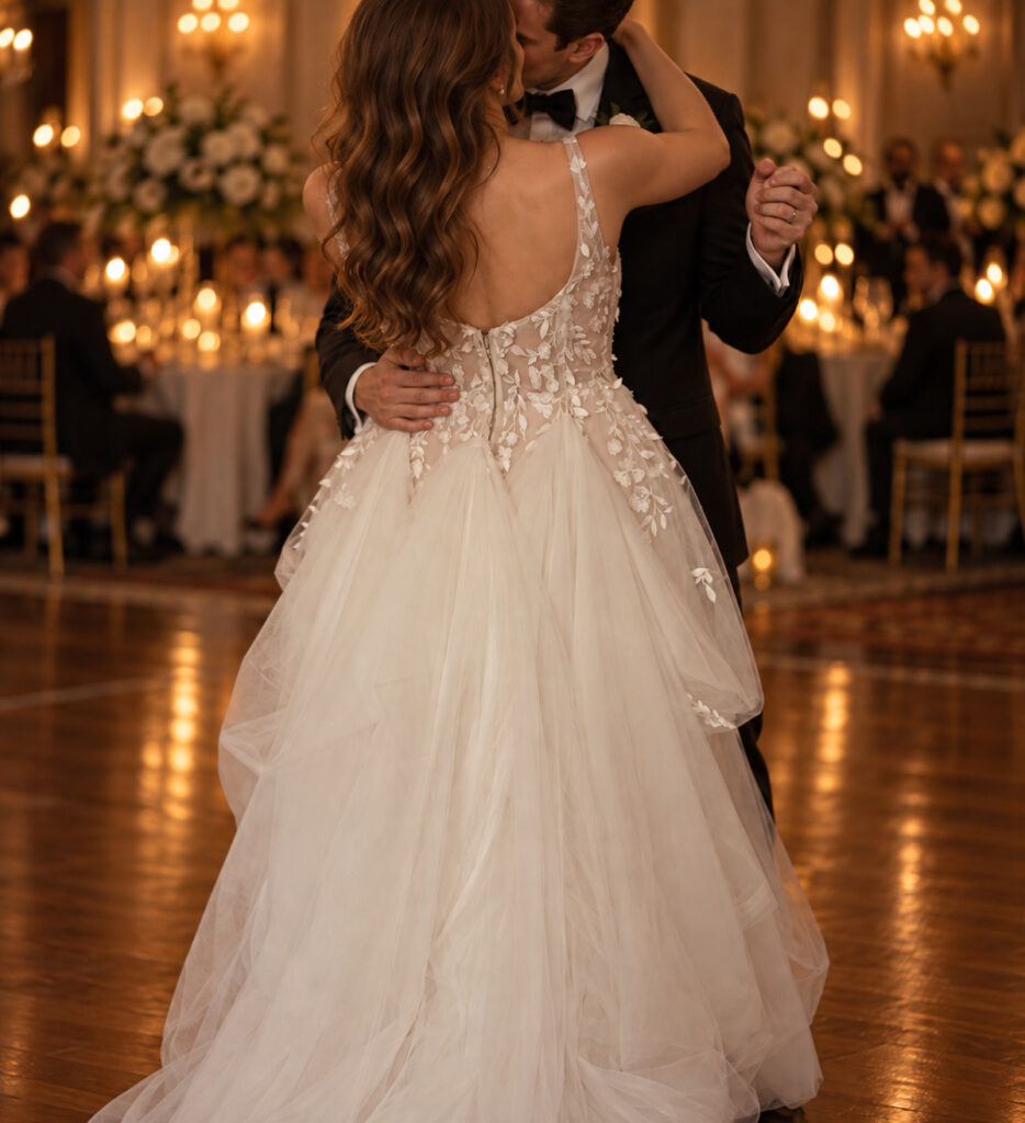 Bride and groom first dance with three point American bustles done up.