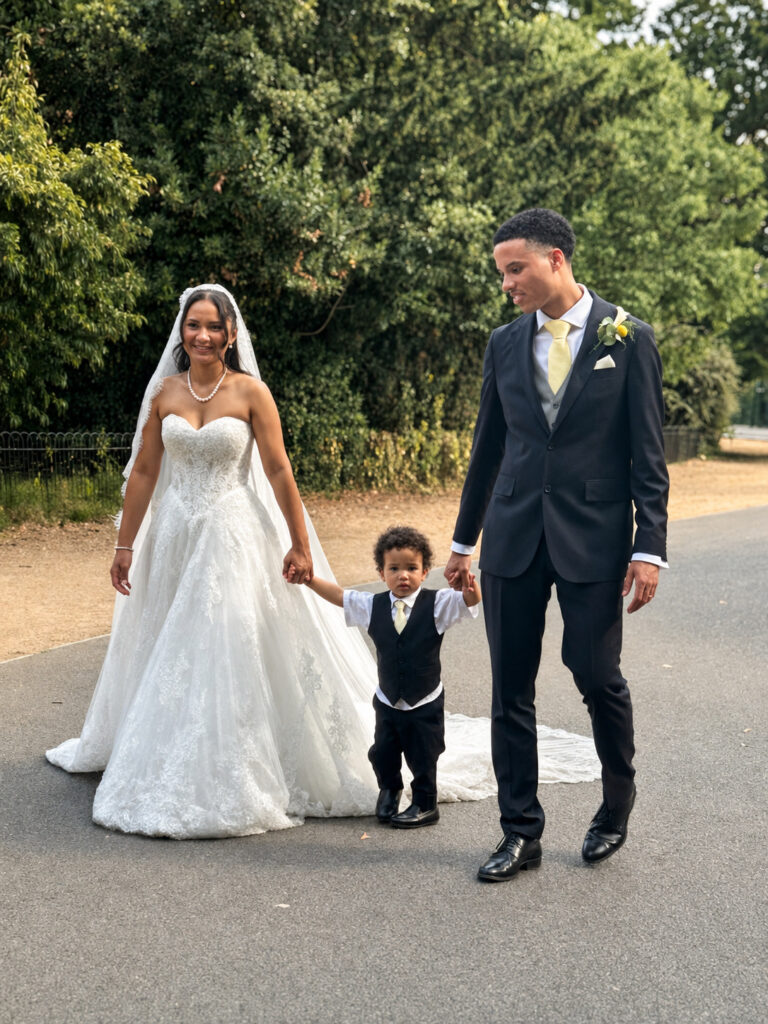 Sutton bride wearing her altered Anna Sorrano Mercia gown while walking with her family