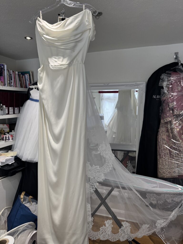 Vivienne Westwood Nova Grace bride with lace veil and detachable train professionally steam pressed