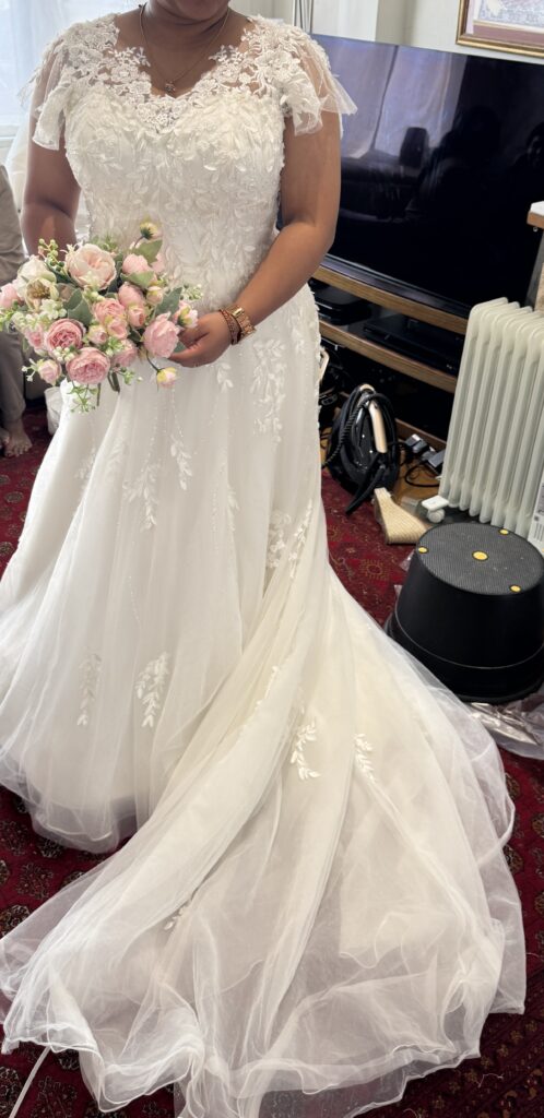 Hayes wedding dress alterations on an Essense of Australia D3529 gown with a redesigned lace neckline and flutter sleeves.