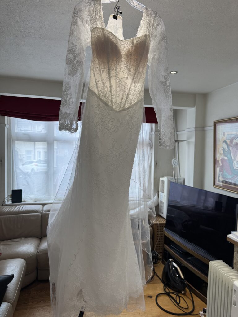 Bridal dress and mother’s veil completely professionally steam pressed.