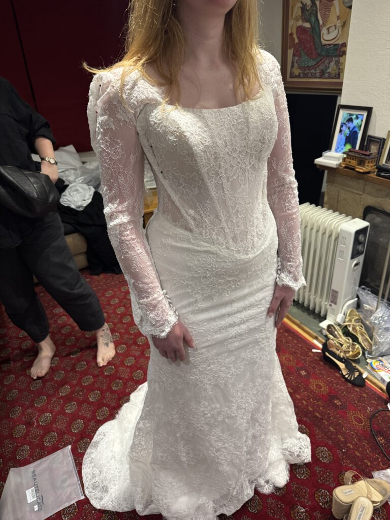 Maggie Sottero Bromley Bridal Alterations showing finished lace wedding dress resized by one full dress size