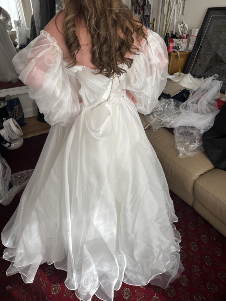 Daria Karlozi Wedding dress All pinned up American Bustles at first fitting for bride from Redhill.