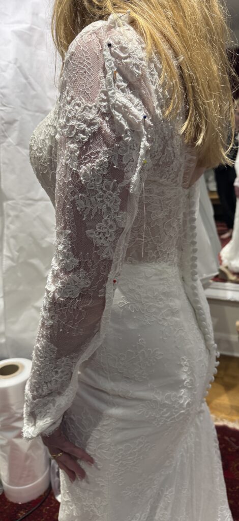 Maggie Sottero Ariadne wedding dress sleeve tapering and shoulder line readjustment during specialist bridal alterations