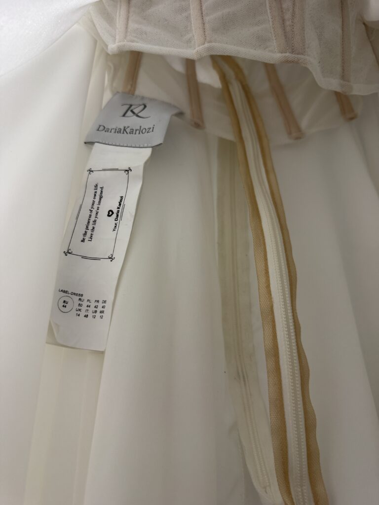 Daria Karlozi Wedding Dress Alterations completed showing Inside view after all adjustments showing inner corset and dress label