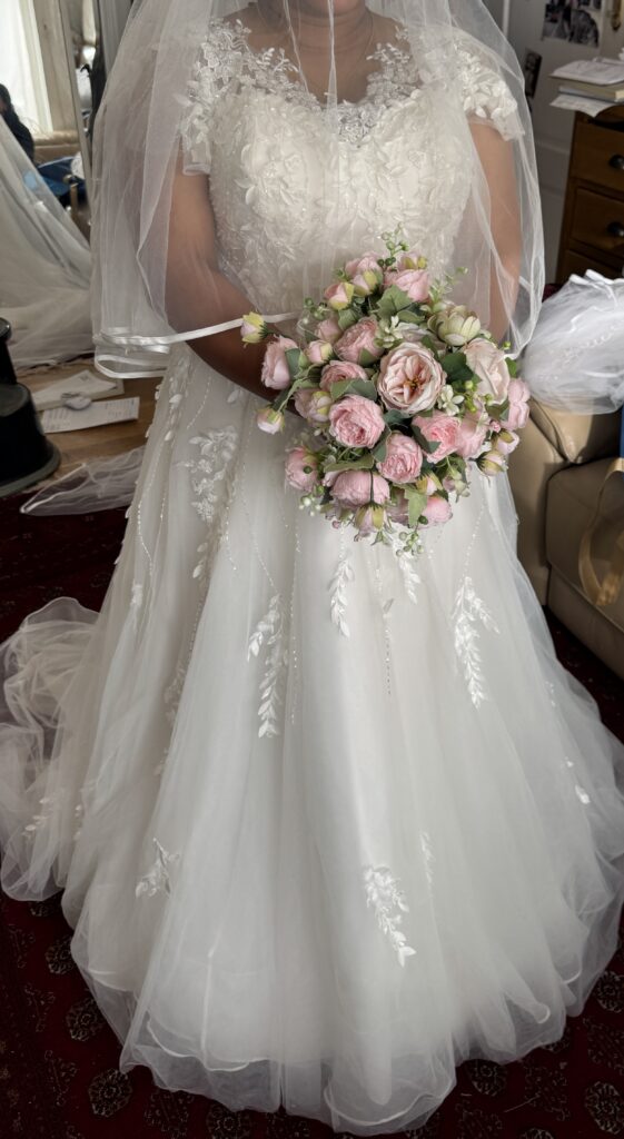 Hayes wedding dress alterations on an Essense of Australia D3529 gown with a redesigned lace neckline and illusion shoulders