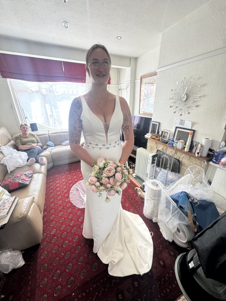 Bride wearing altered Madi Lane Cooper wedding dress at Sutton bridal alterations studio