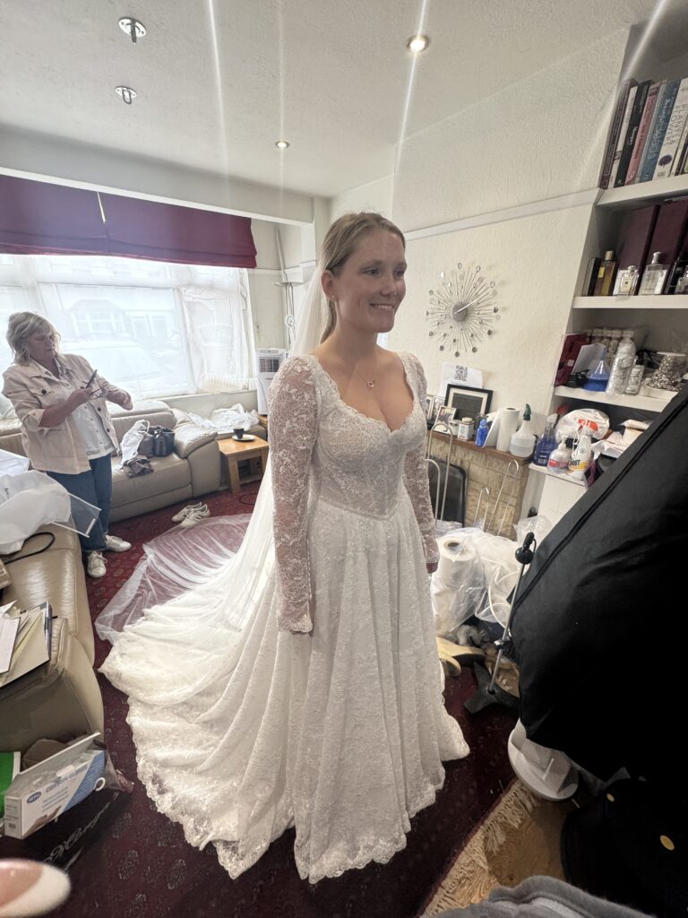 final fitting of the Intricately beaded lace wedding dress of a Yedyna Estia bridal Morgan Davies alterations