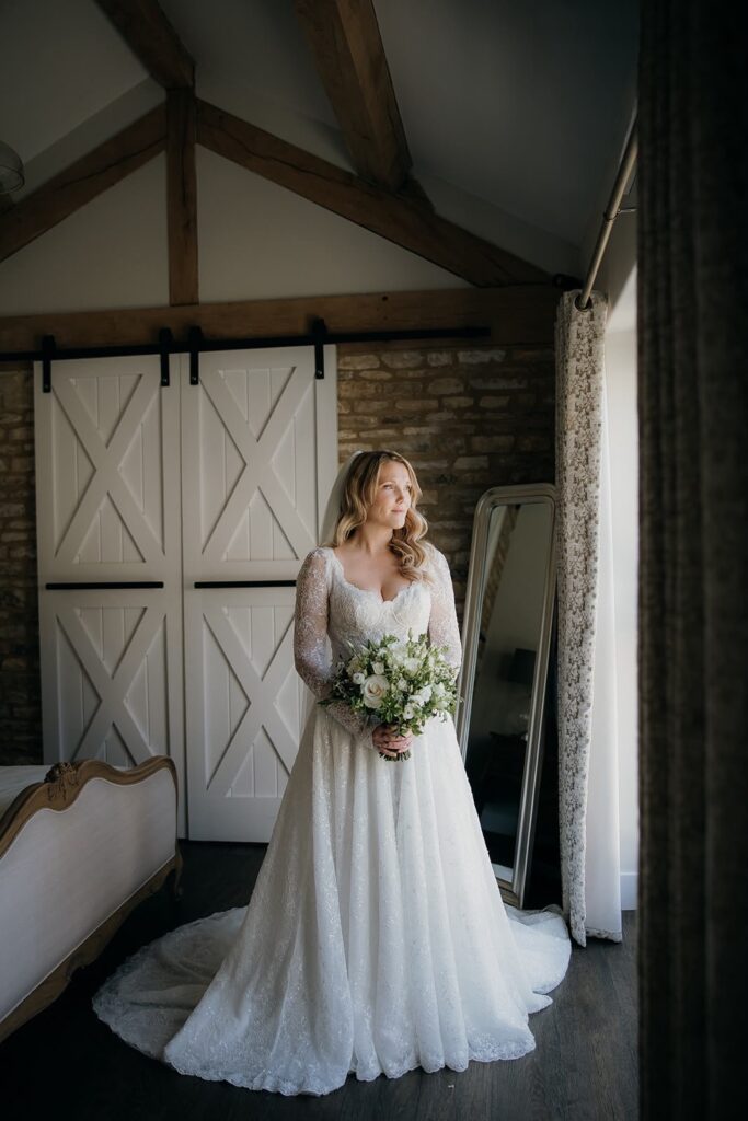 Banstead bride wearing her Yedyna Estia beaded lace wedding dress purchased from Morgan Davies Bridal.