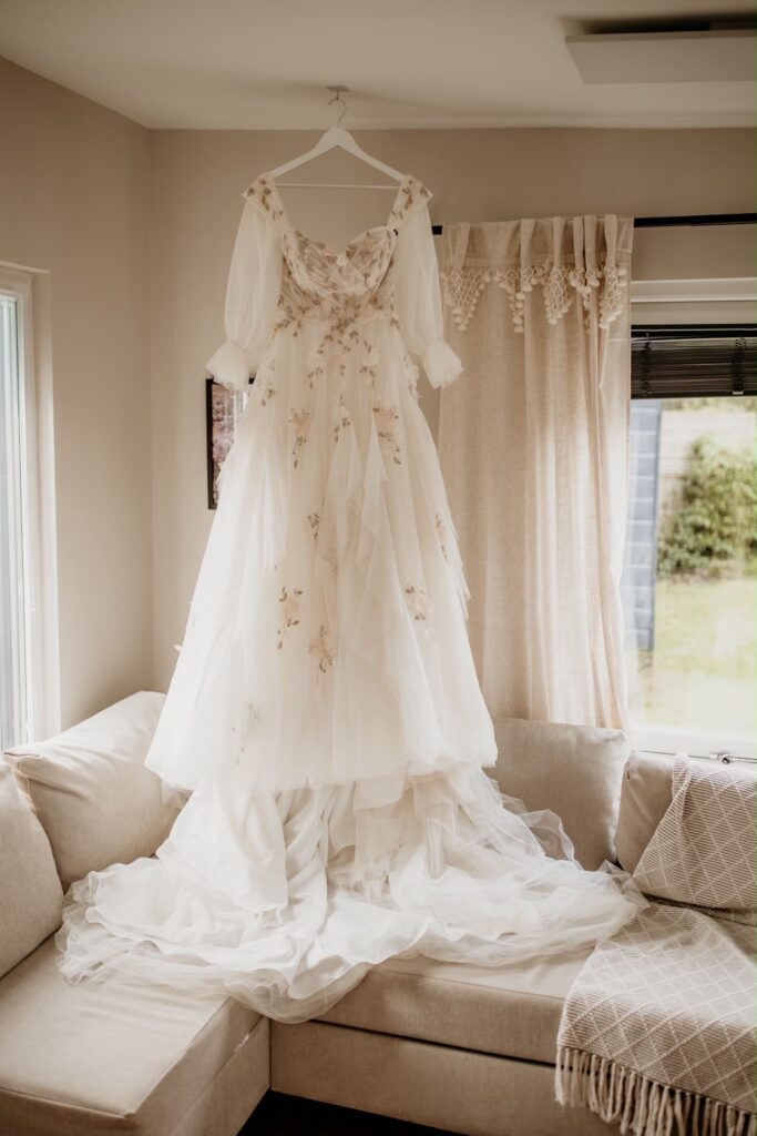 Raynes Park Morilee Bridal Alterations, Blush Pink Morilee wedding dress with embroidered floral appliqués, sheer sleeves and layered tulle skirt