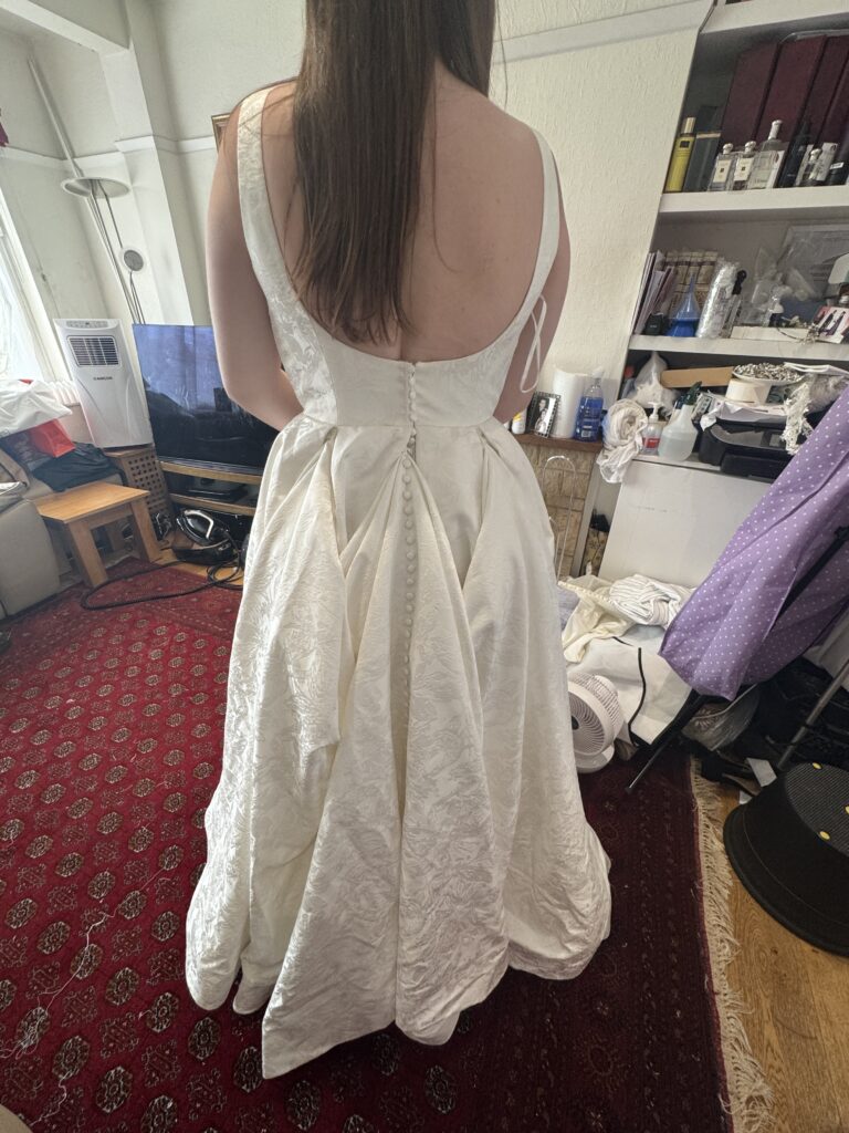 Three point american bustles added to WED2B Florentina bridal dress train for the first dance.