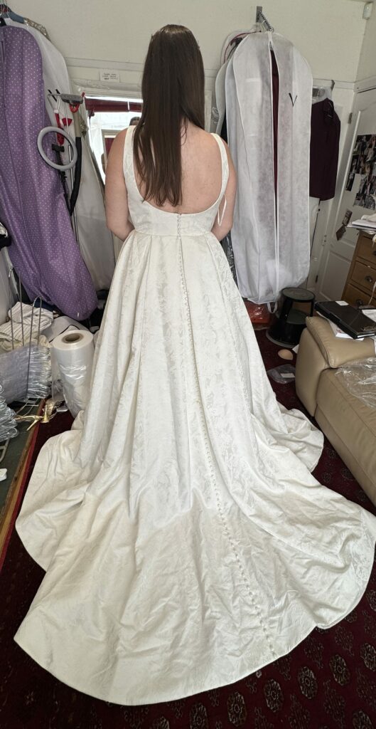 back view Oxted bride wearing her ivory WED2B Sofia Cruz Florentina ballgown after bridal alterations in Sutton, Surrey