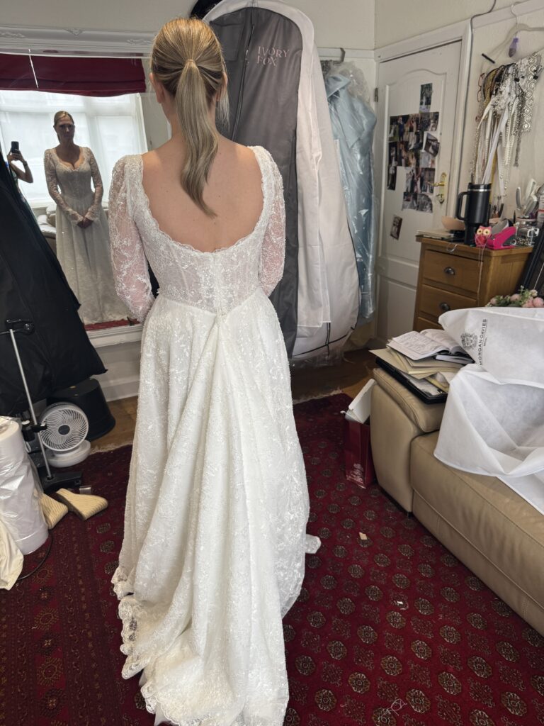 Back view of Yedyna Estia lace wedding dress with bespoke lace panel concealing the zip closure.